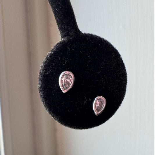 white gold and pear diamonds on a black background