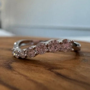 White Gold with diamonds on a wooden surface