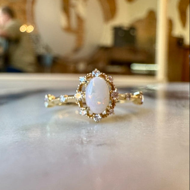 Oval Opal, Diamond, and Gold Contemporary Ring