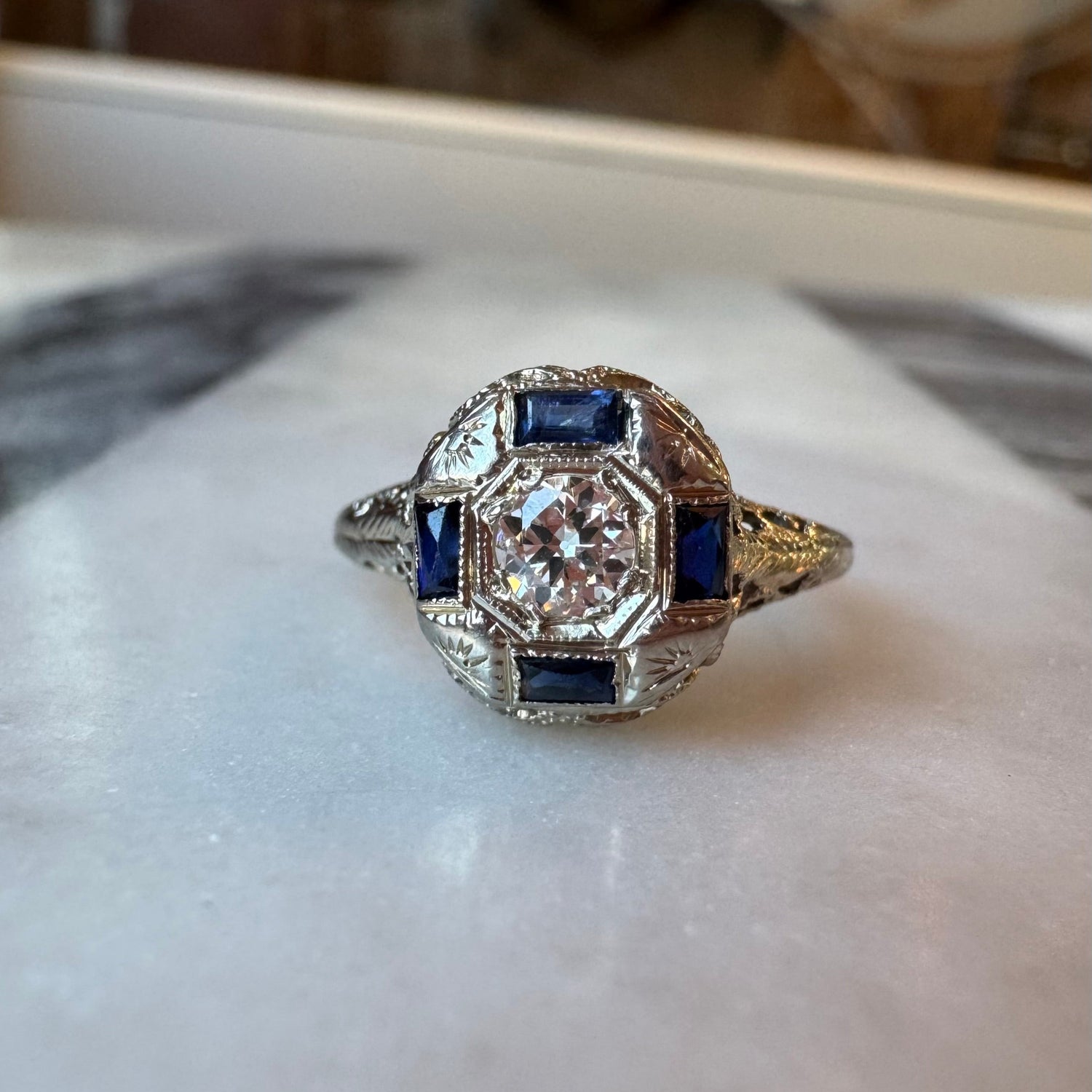 art deco style ring with 4 baguette sapphires in 18k white gold